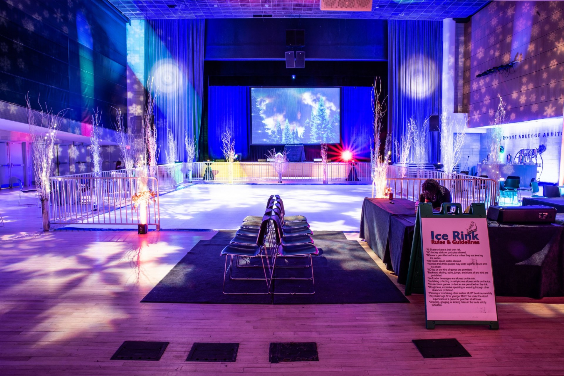 An indoor ice rink set up for a holiday party