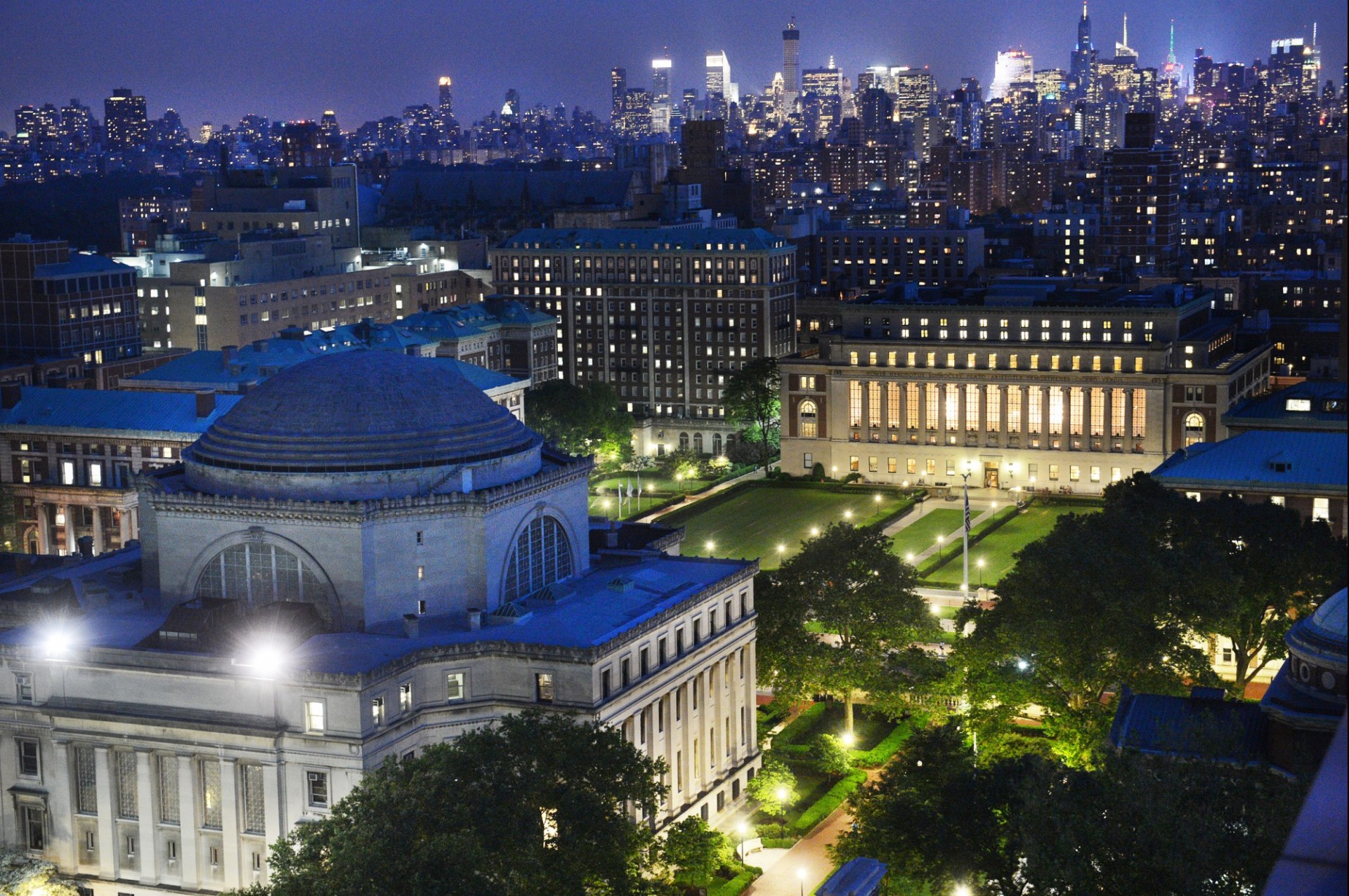 An aerial view of Columbia University's Morningside Campus at night.
