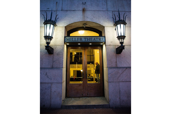 Lights are mounted on either side of the glass door to enter Miller Theater