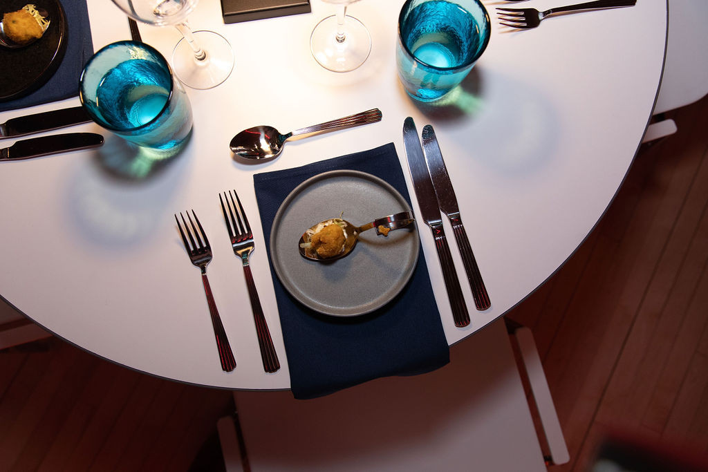 Photo by Kevin Dale Table set with first course