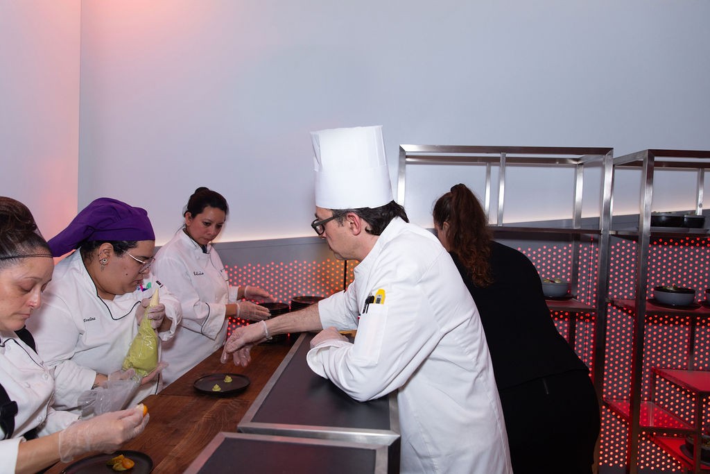 Photo by Kevin Dale Chefs in the kitchen plating