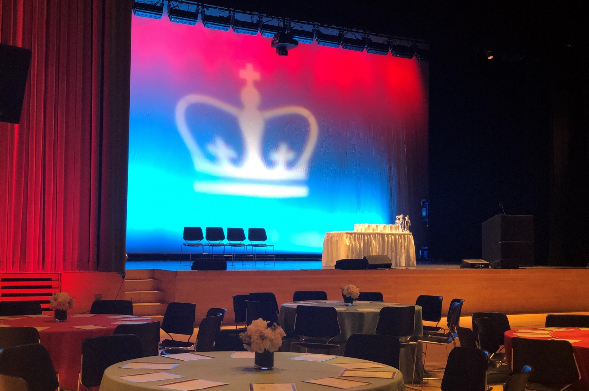 Projection of the Columbia crown on a screen in Lerner Hall