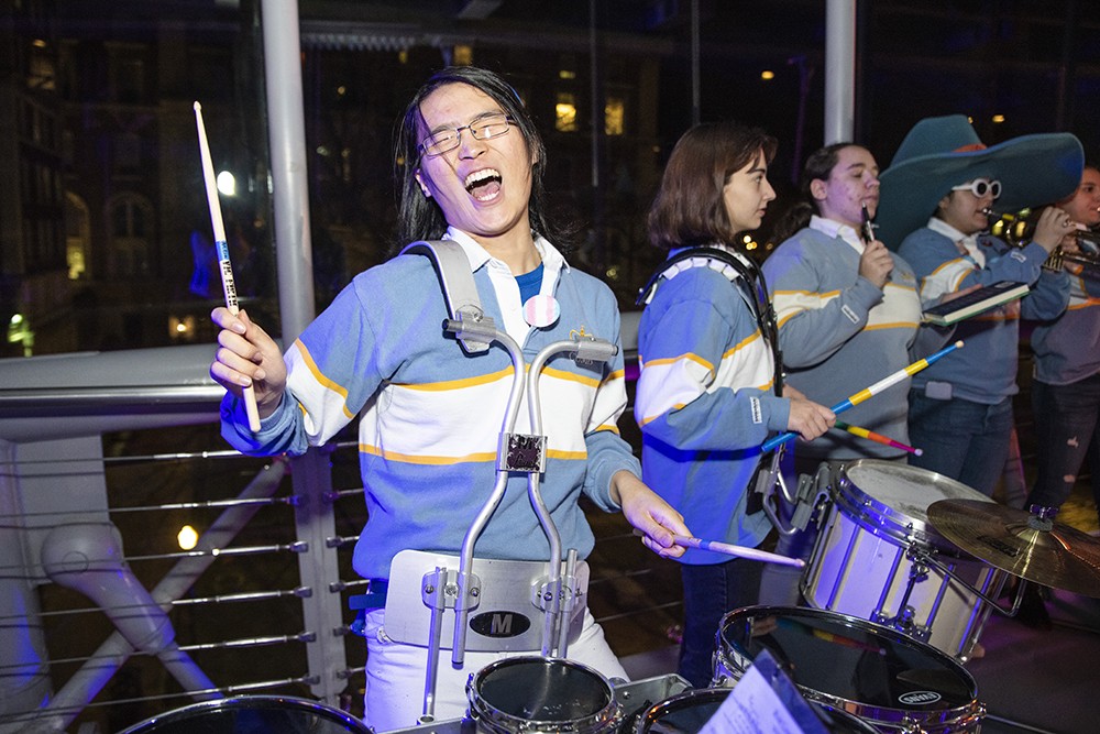 A student drummer having fun during the Glass House Rocks event at Lerner Hall. 