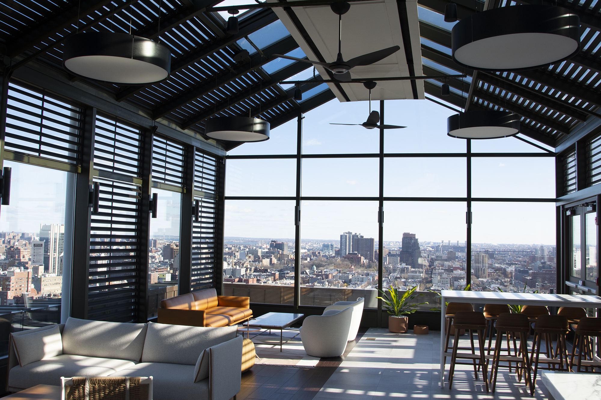 Butler Atrium is in intimate indoor lounge featuring floor to ceiling windows that frame views of the upper Manhattan skyline
