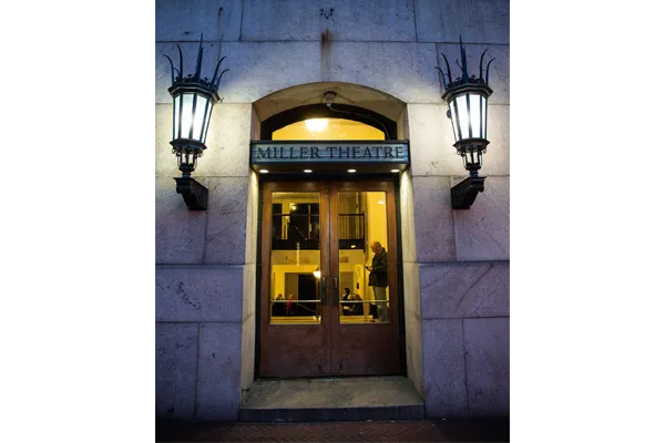 Lights are mounted on either side of the glass door to enter Miller Theater