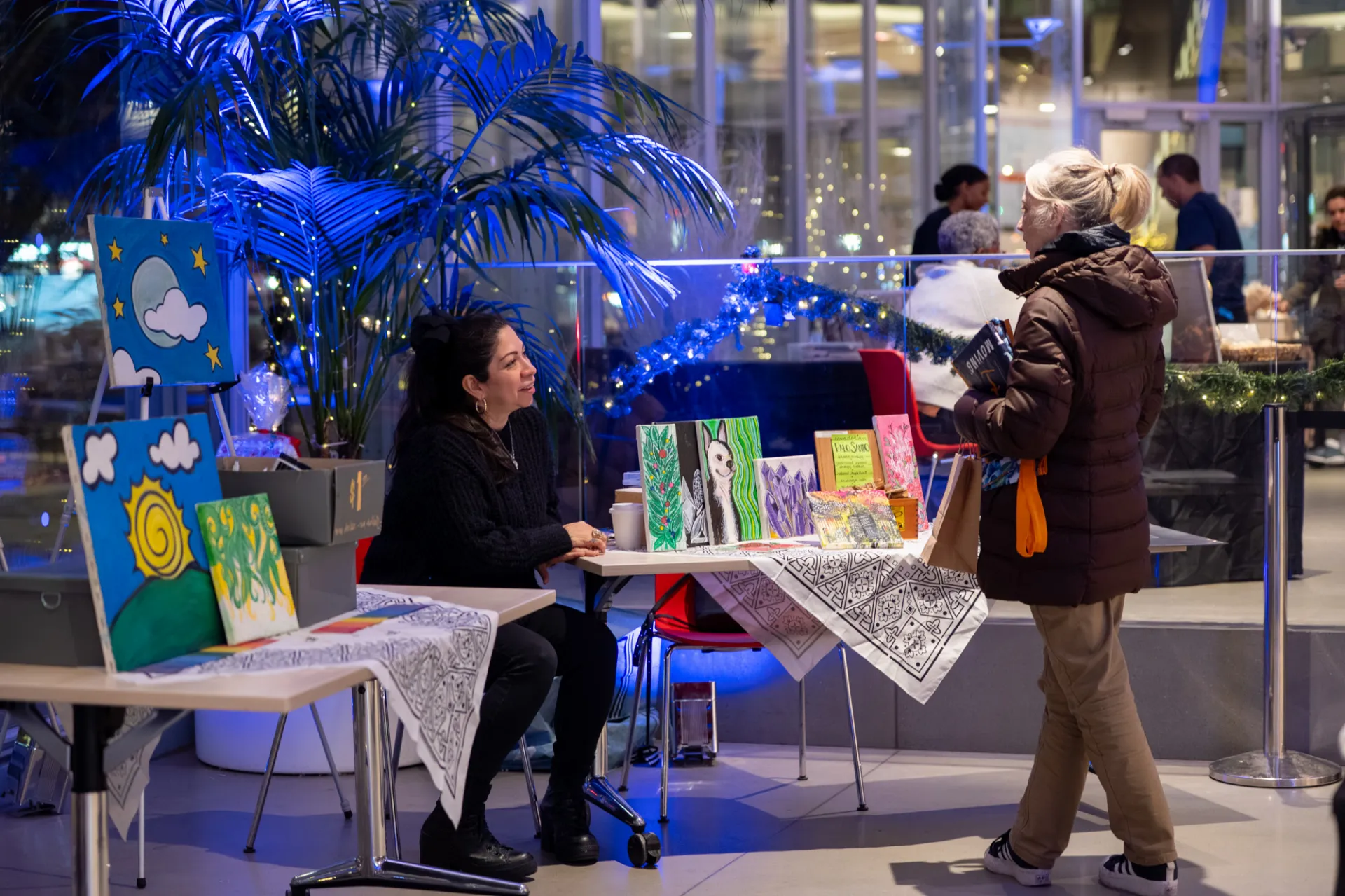 Shopper speaking with vendor
