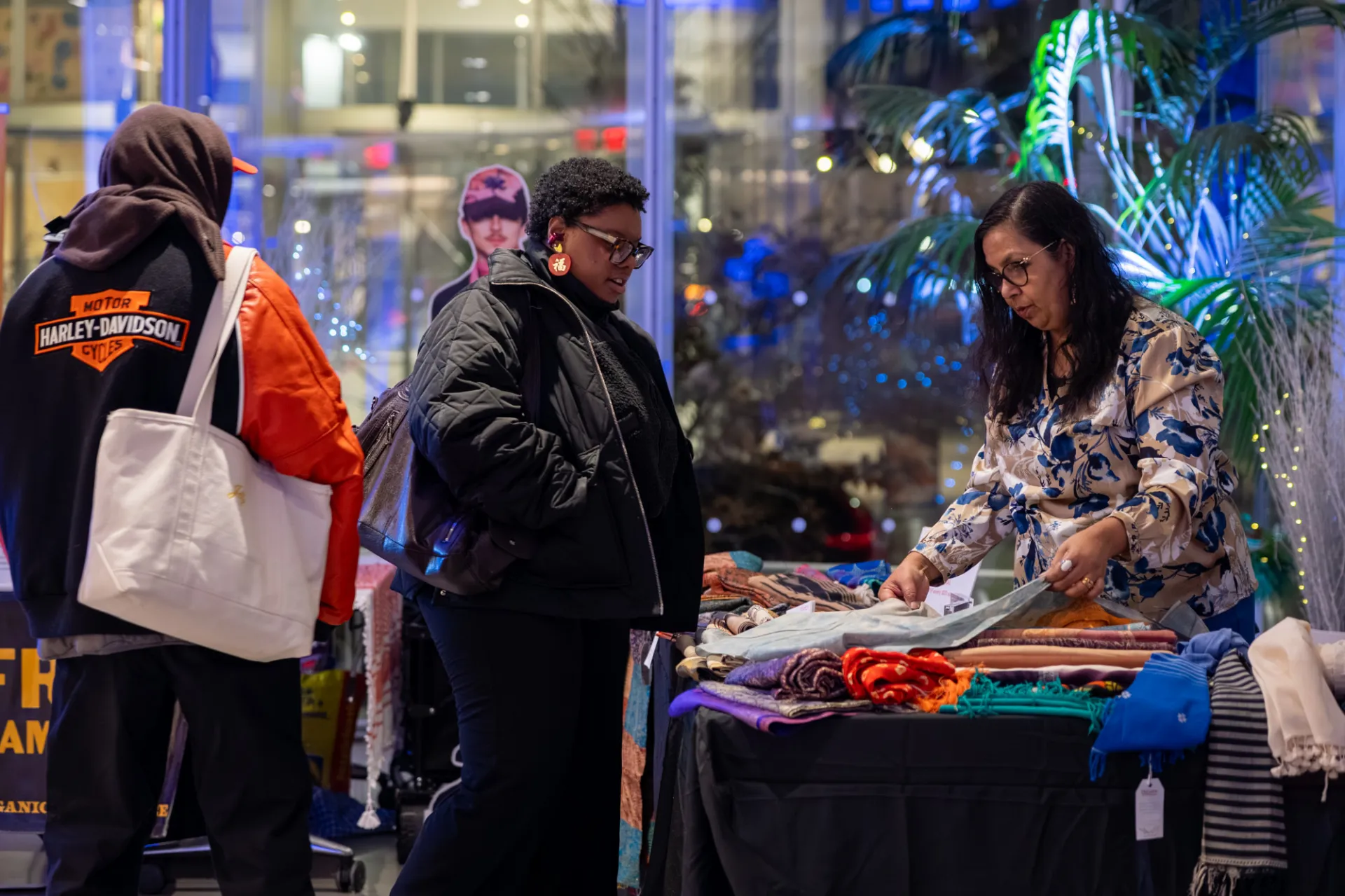 Shoppers interact with vendors