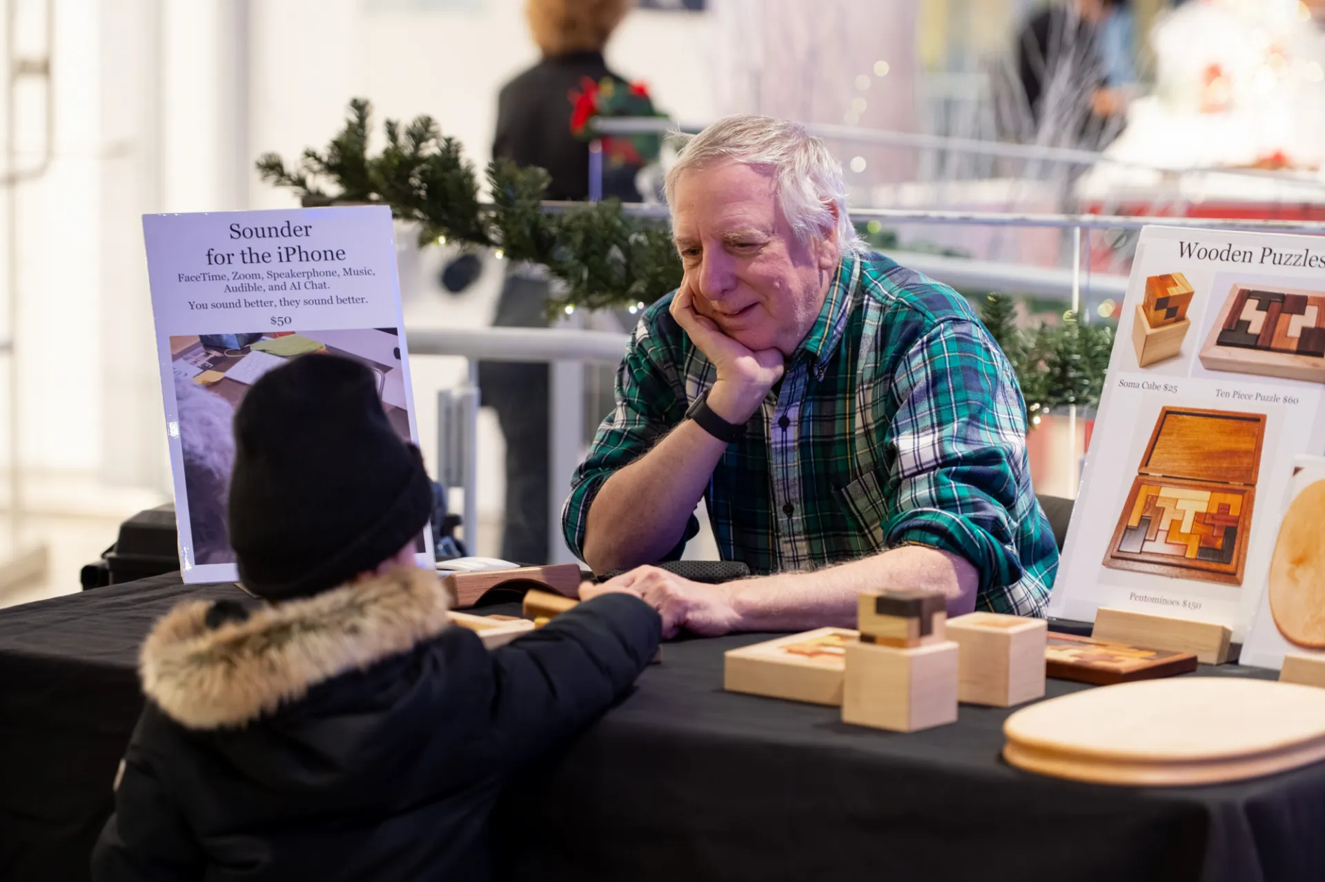 Vendor speaking with child