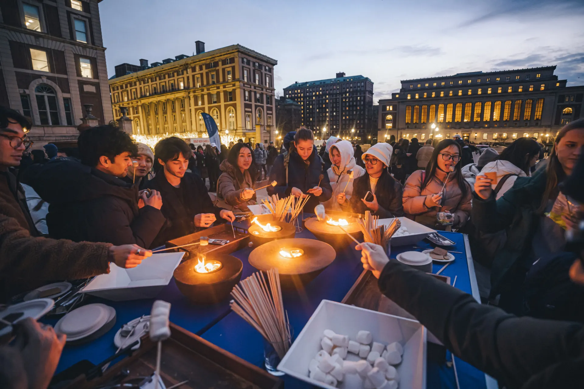 Students gather around the s'mores station on Low Plaza