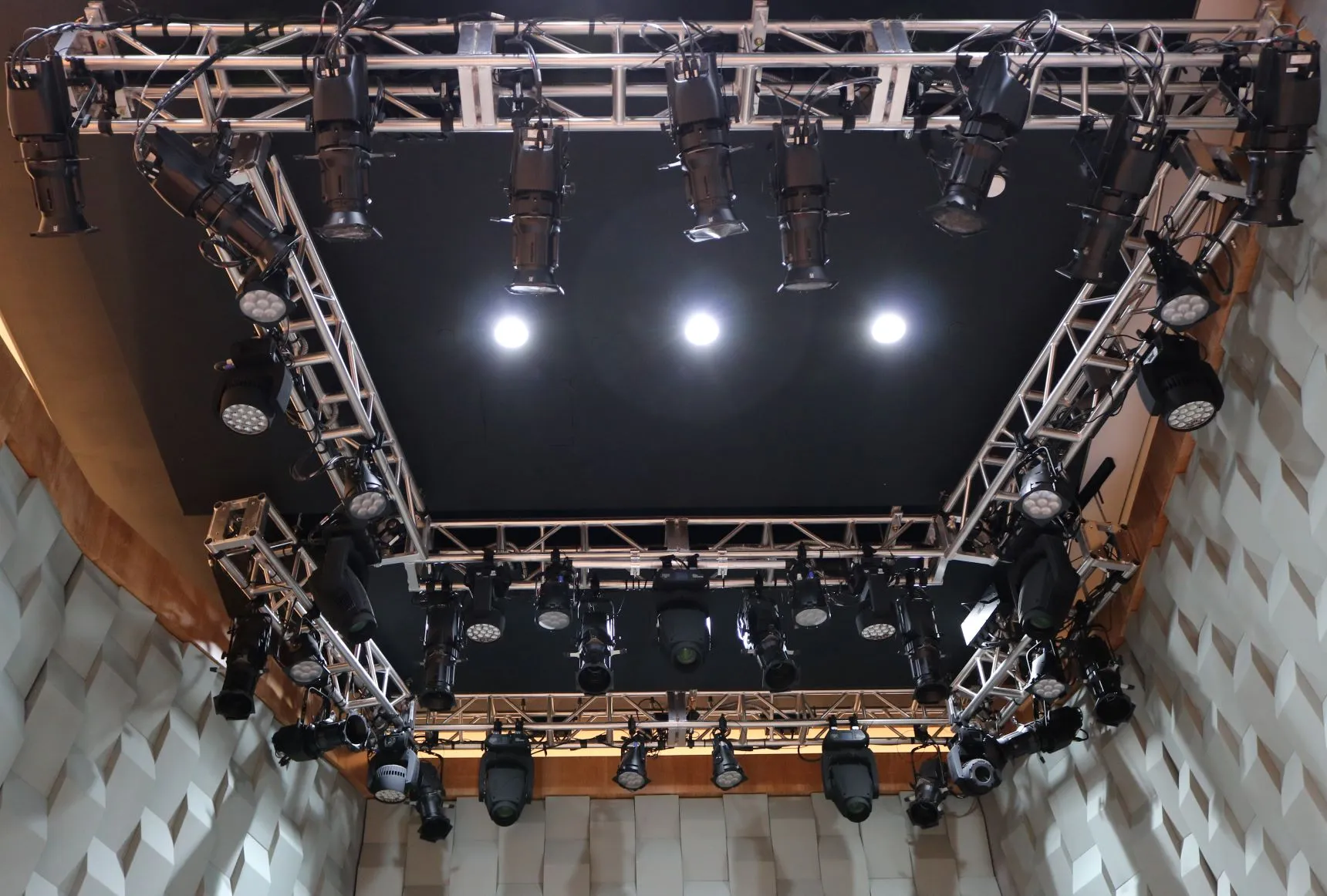 The stage is outfit with theatrical lighting