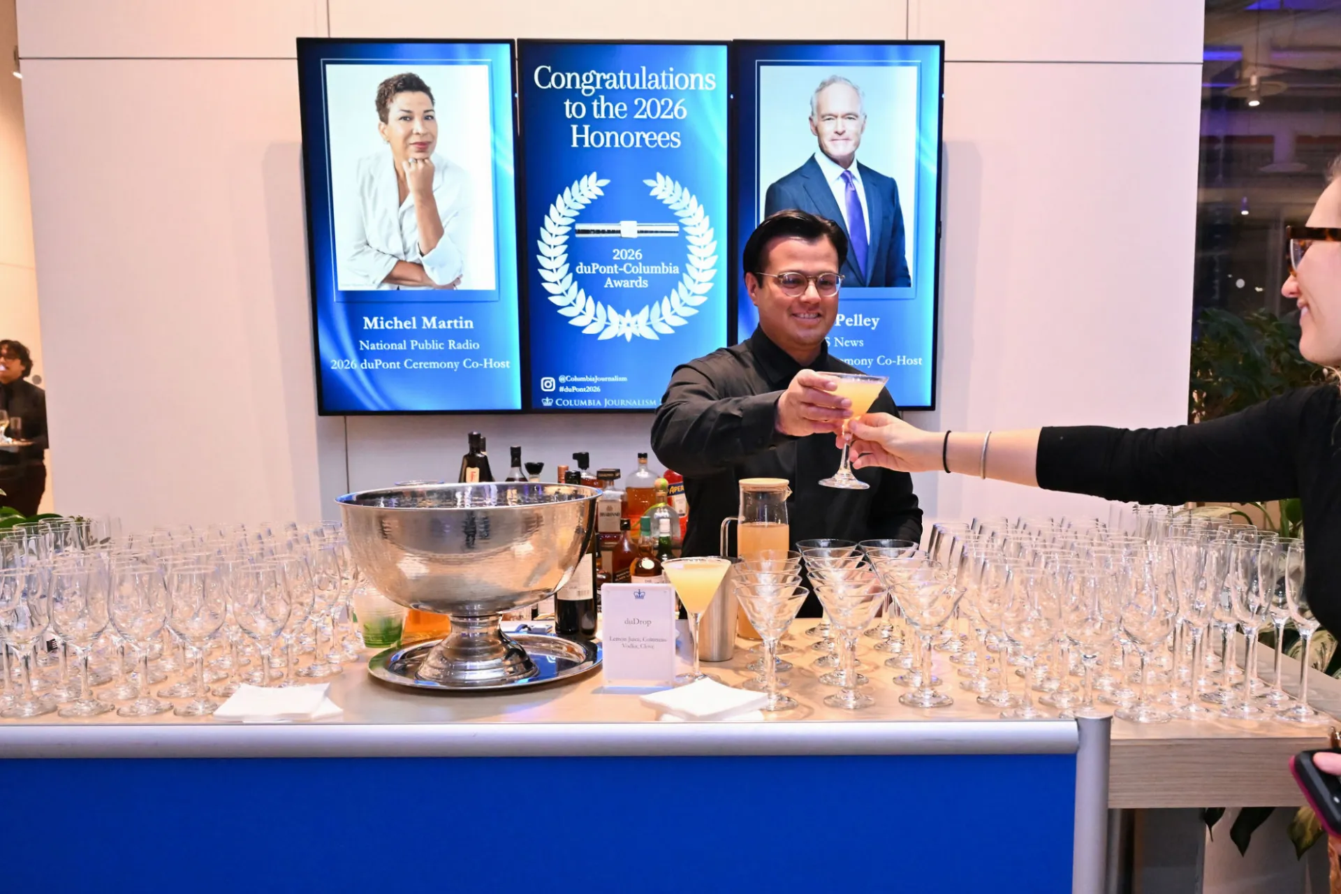 Staff serves cocktail at special event