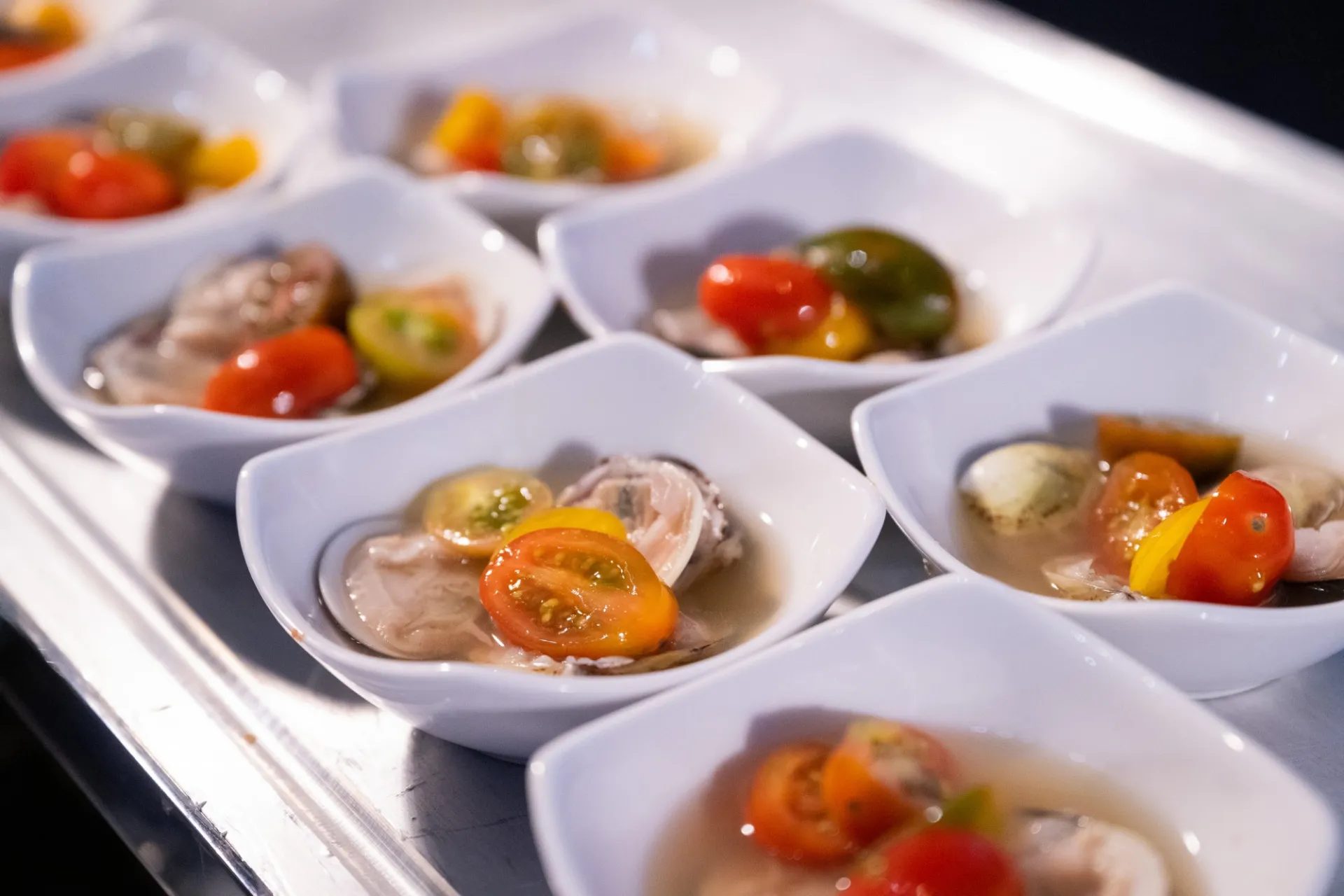 Bowls of colorful soup with tomato