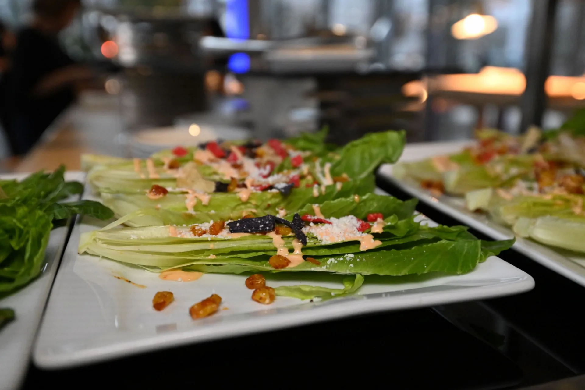Chipotle Caesar Salad: tortilla chips, fried corn ribs, fresh cojita cheese