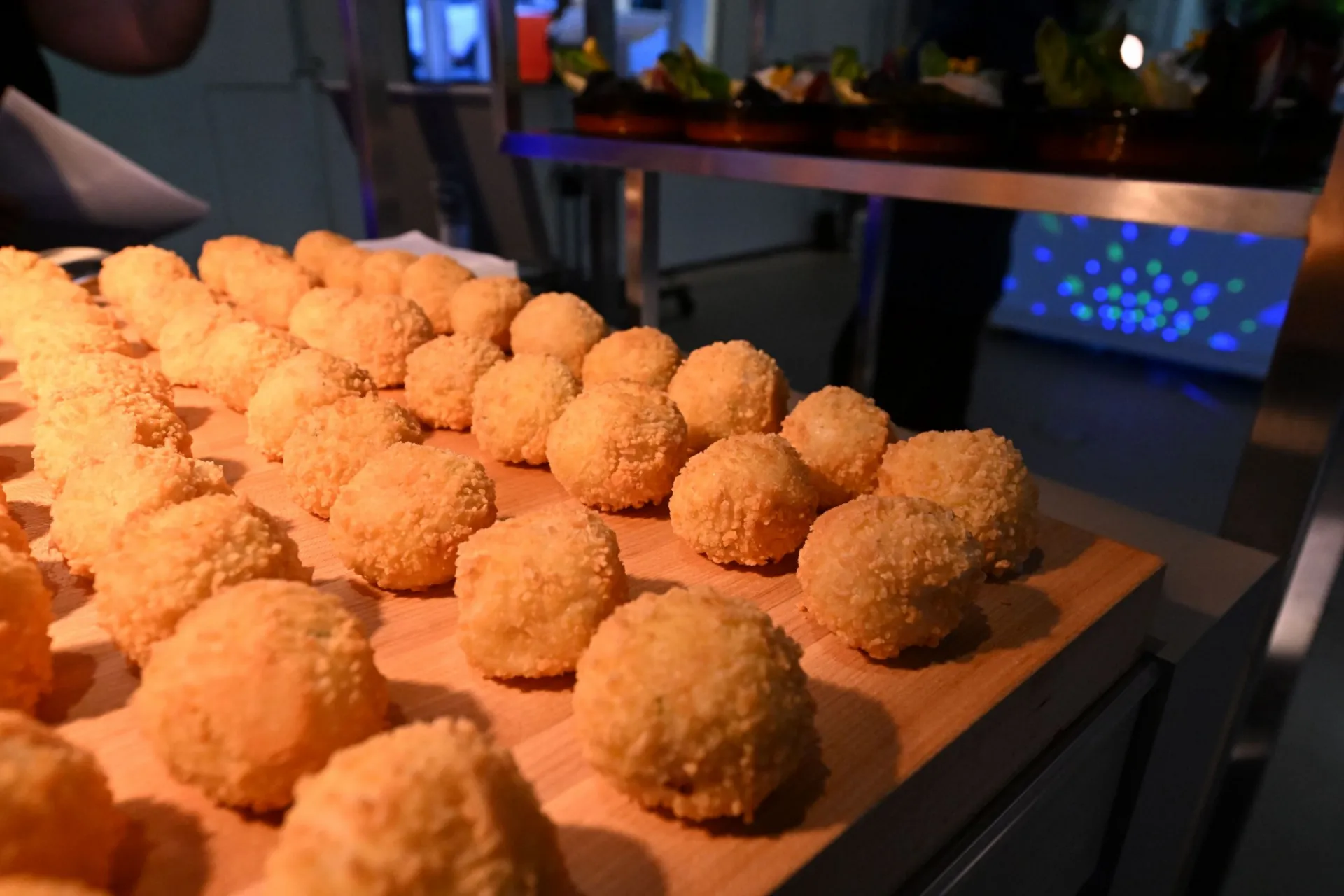 Arancini station featuring classic, mixed mushroom, lemon saffron, or meat ragu