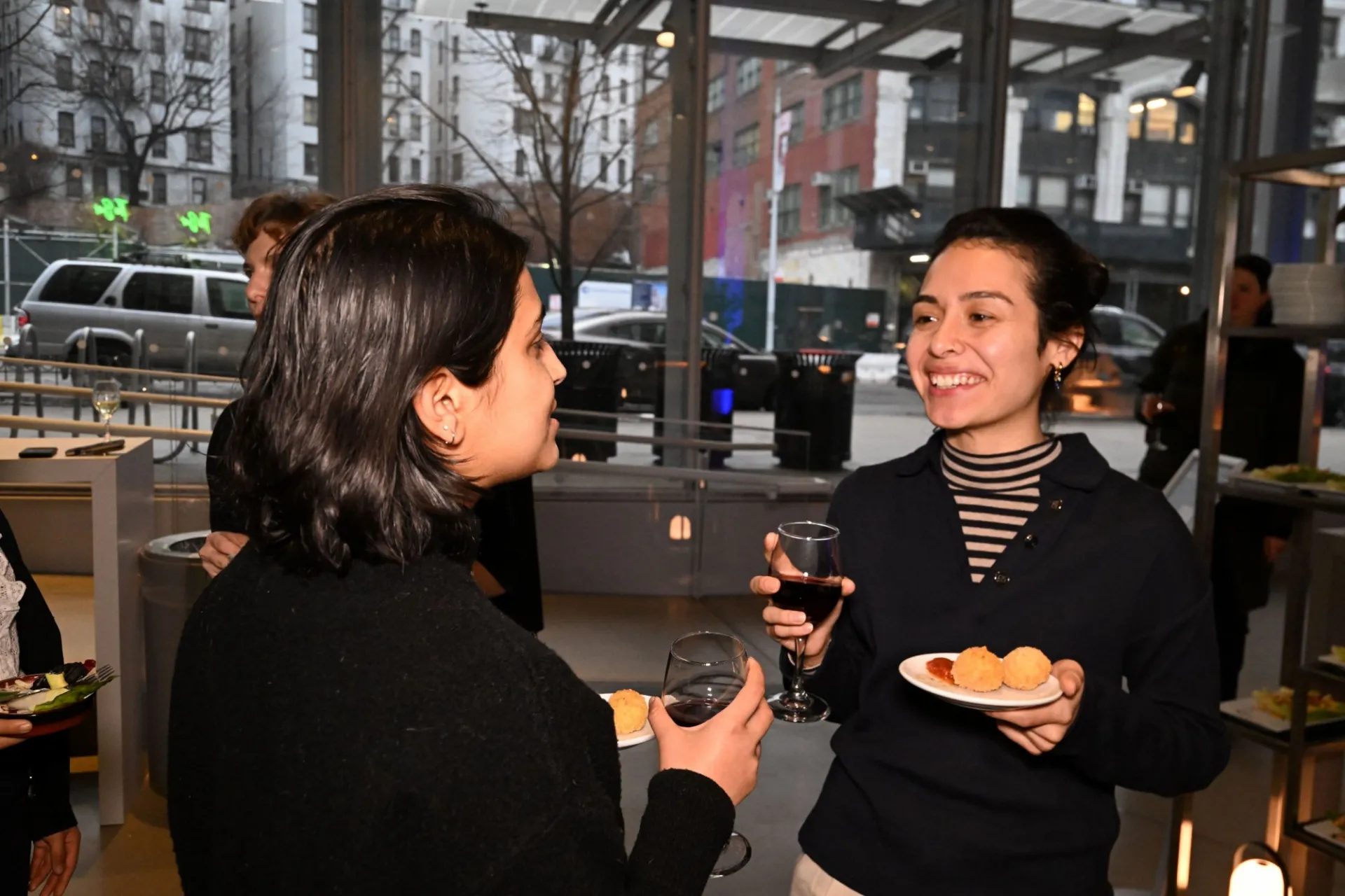 Guests enjoying samples from the Arancini station 