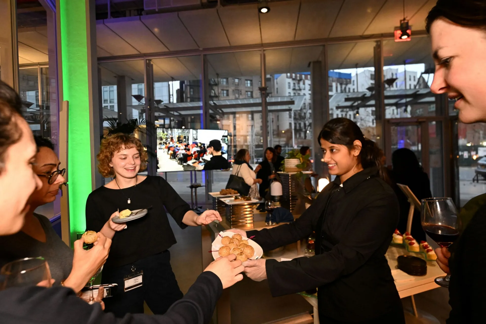Guests enjoying passed hors d'oeuvres