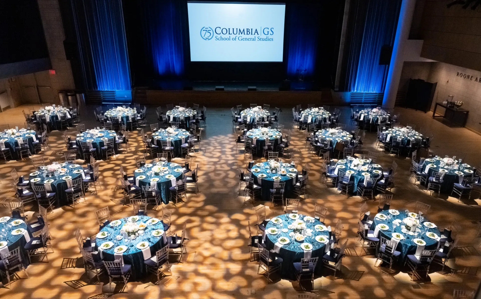 A wide shot of the entire room with set tables