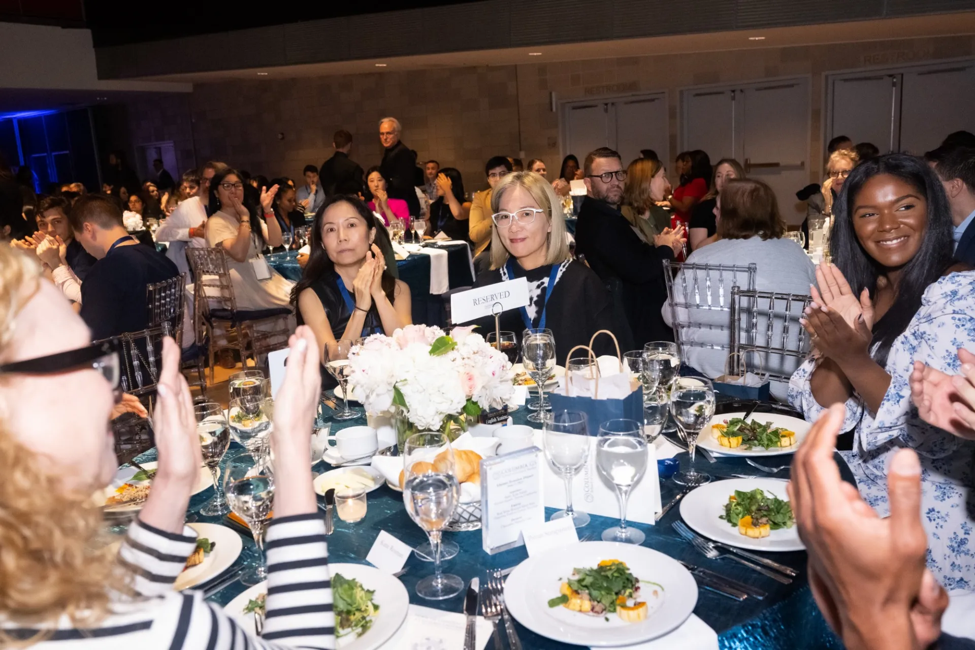 A table full of guests with their first course