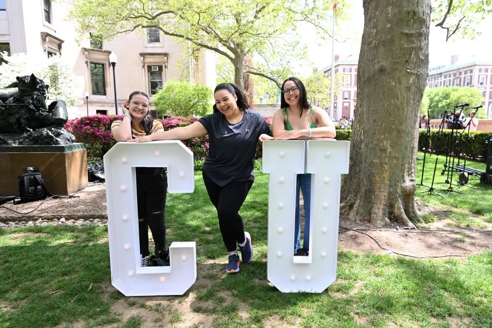People posing with CU letters