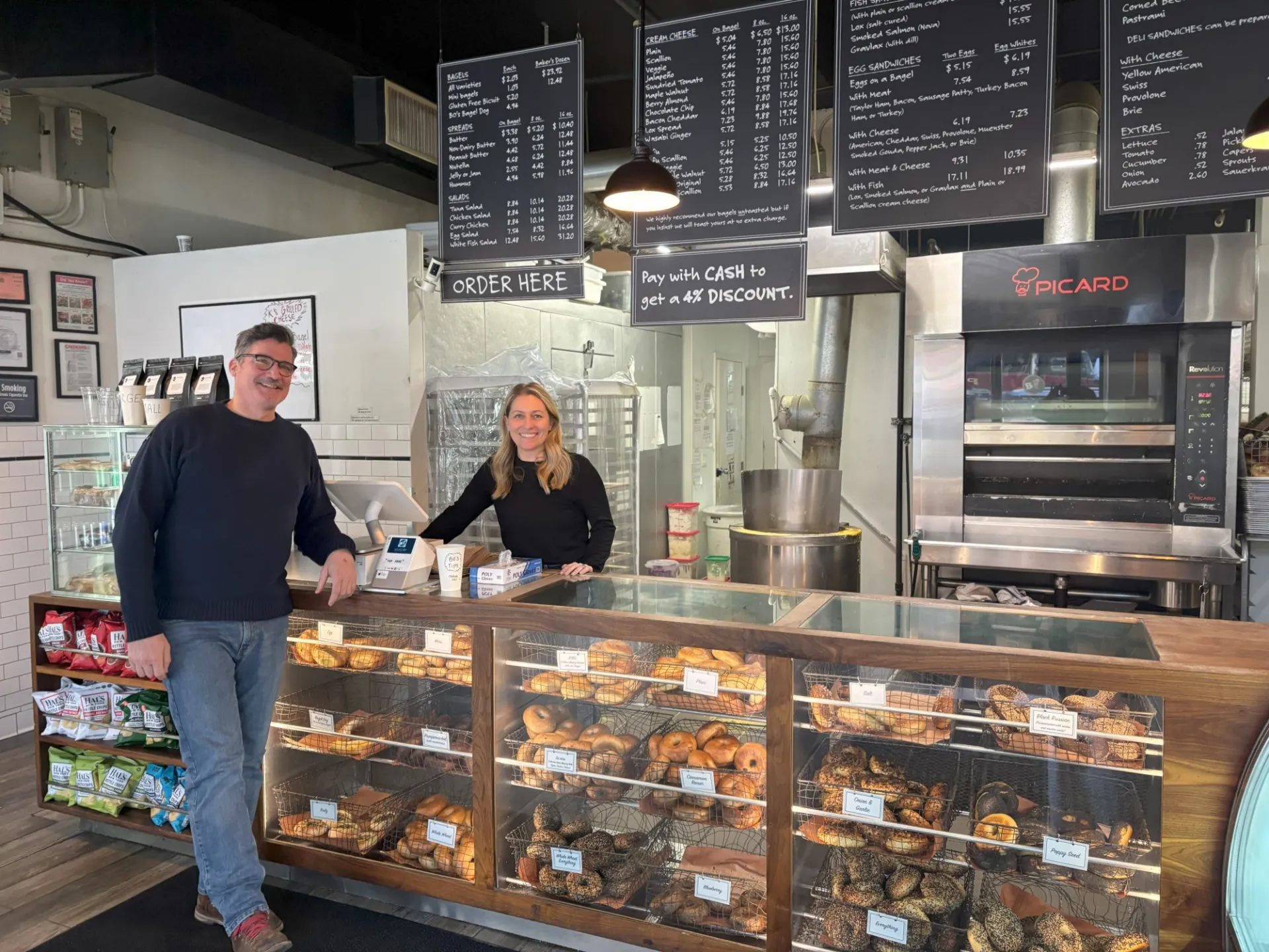 Andrew Martinez (left) and Ashley Dikos (right) of BO's Bagels