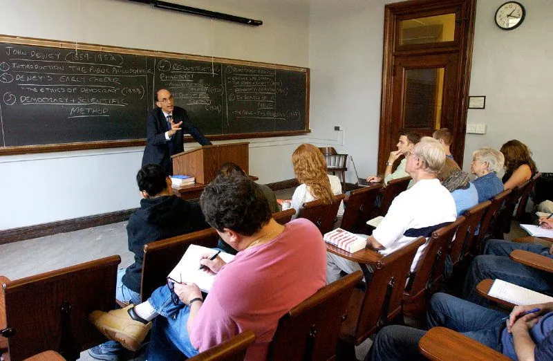 Students in a classroom with instructor at front 
