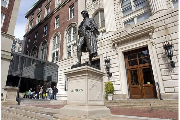 A statue of Thomas Jefferson stands at the front of the Columbia Journalism School